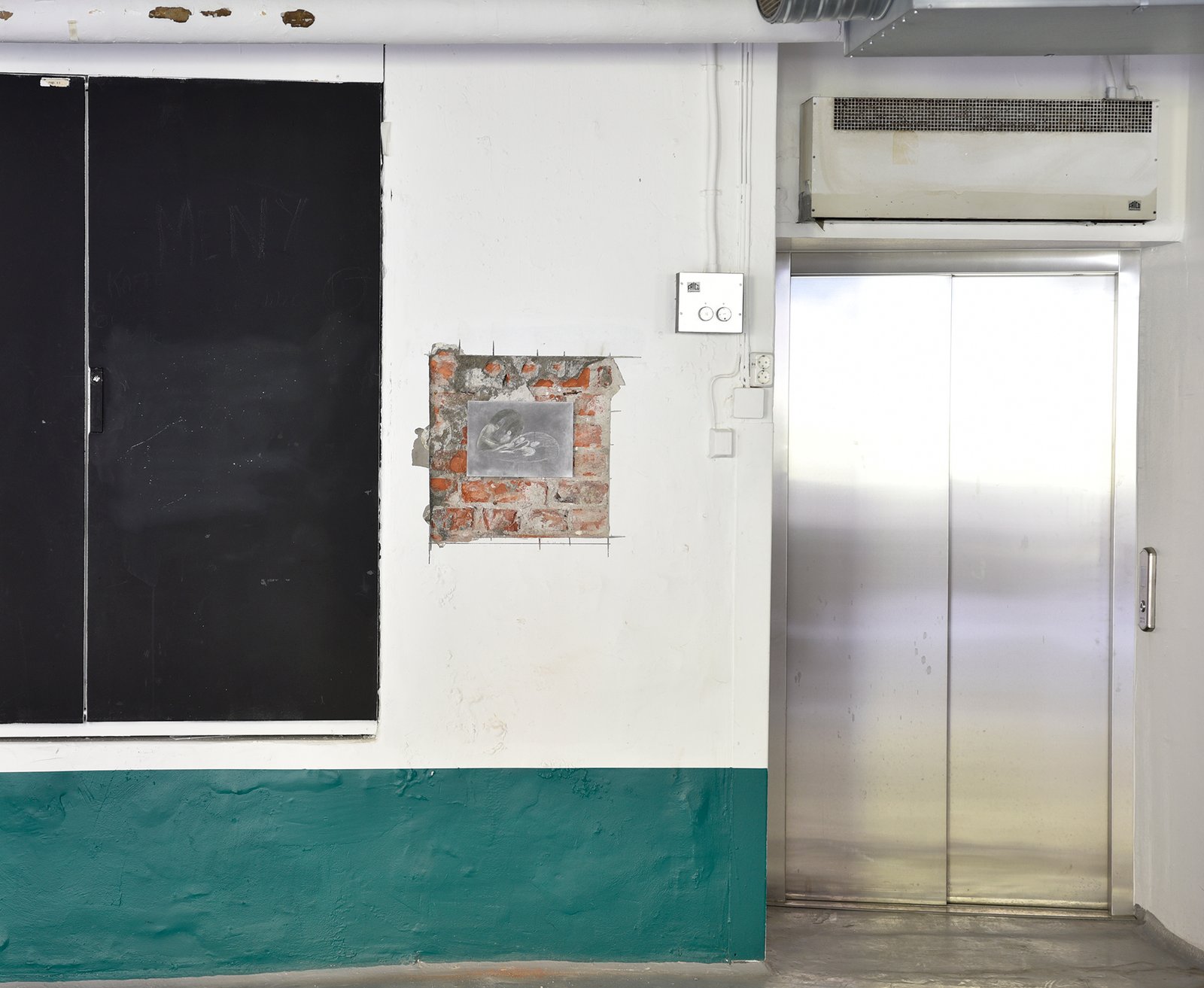 Installation view of drawing on brick wall