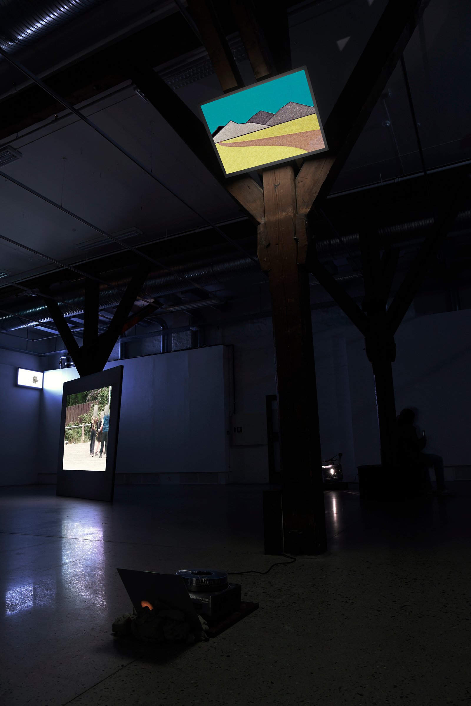 slide projection of landscape leaflet installation view of artwork by anna clawson